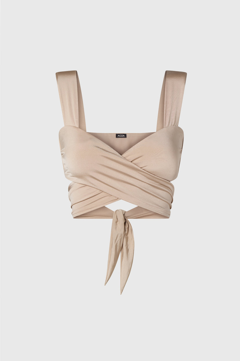 Wrap style bikini top in shimmering beige, on a white background